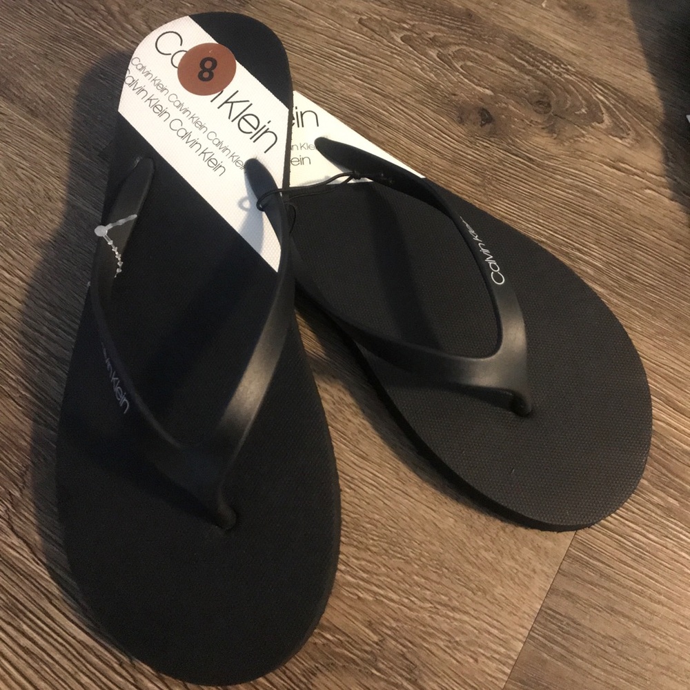 Calvin Klein flip flop slippers.